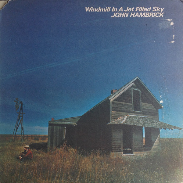 Windmill In A Jet Filled Sky