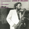 Keshavan Maslak - Loved By Millions (Vinyl, LP, Album) Very Good Plus (VG+) / Very Good Plus (VG+)